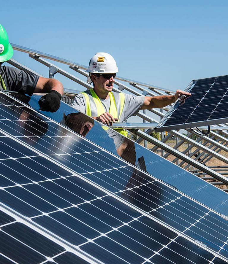 people working in solar panel